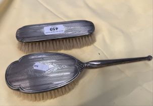 A pair of hallmarked silver backed brushes