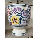 A Poole pot with floral design on white ground