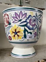 A Poole pot with floral design on white ground