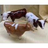 Three Beswick cattle figures. Champion Whitehill Mandate; Ch Sabrina's Sir Richmond 14th; and