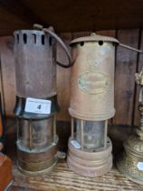 Two vintage miners lamps; a Richard Johnson Clapham Morris Ld, Manchester & Liverpool and a