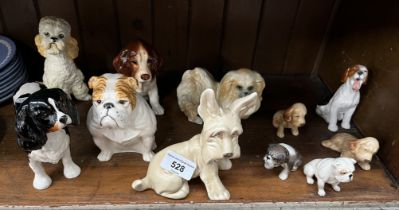 11 dogs including a Sylvac apricot poodle and other Sylvac, Beswick, Royal Doulton etc.