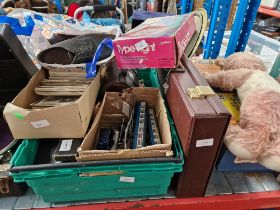 A box containing Hornby Dublo carriages, postcards, crown green bowls, bag of clogs, 2 Bayko