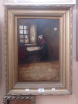 20th century school, oil on canvas, interior scene with woman by a window, 29.5cm x 45cm, signed '