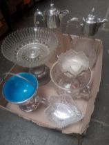 A box of glassware and plated ware.