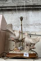 A figural table lamp in the form of two doves
