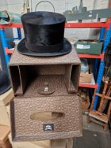 A vintage Tress & Co silk top hat in a Dunn & Co London hat box.