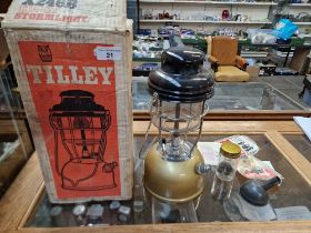 A boxed vintage Tilley lamp.