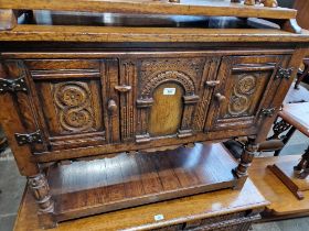 An aged oak side cabinet.