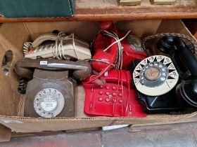 Five vintage telephones.