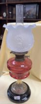A ruby glass oil lamp