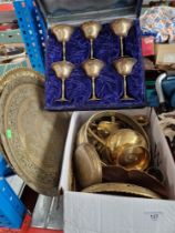 A box of metal-ware, brass, two brass chargers, a set of 6 metal goblets in case, etc.