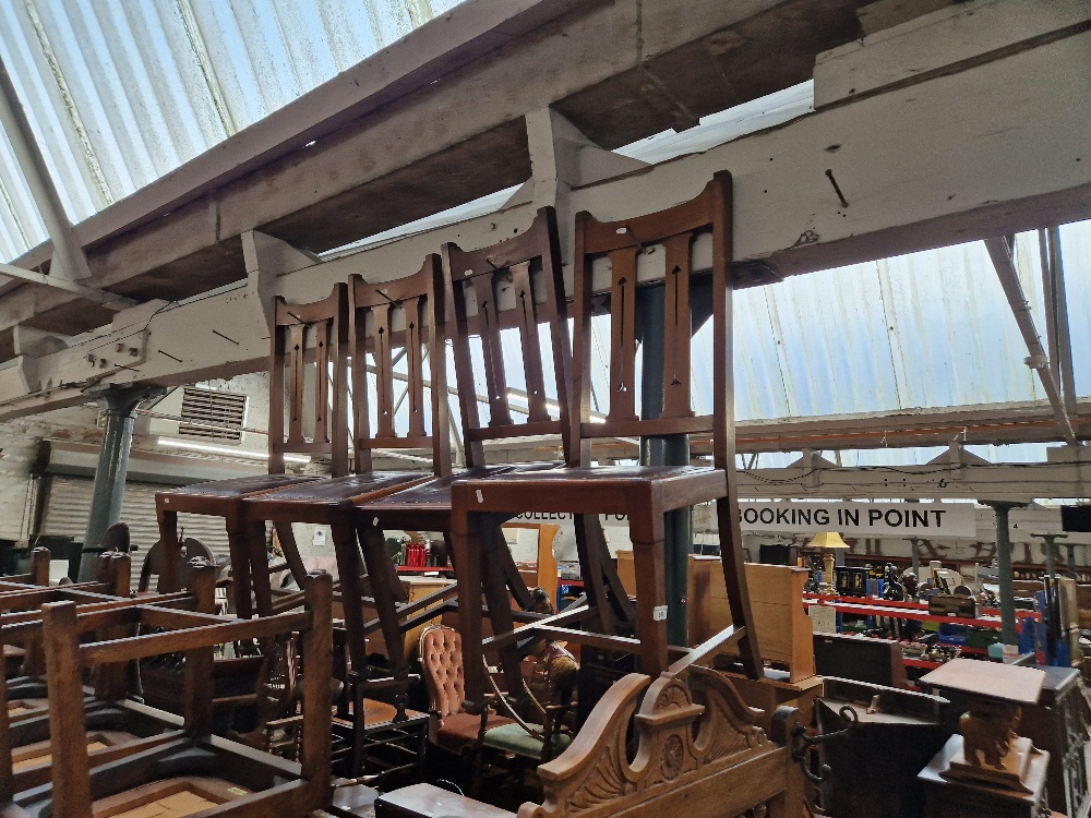 A set of four mahogany dining chairs.