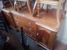 A Victorian mahogany sideboard with pressed glass handles.