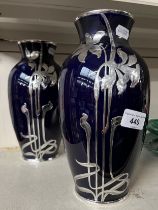 A pair of Art Noveau silver mounted vases, decorated with daffodils.