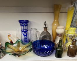 A collection of glassware to include coloured glass, copper cased three sided bottle, various