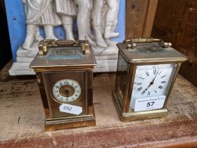 Two small carriage clocks; a British and a French.