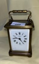 A brass carriage clock by John Nix, Eastbourne.