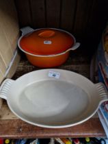 Two Le Creuset items including a lidded pot and a dish casserole.