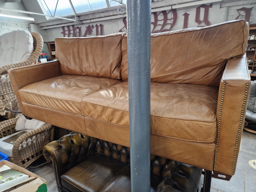 A tan leather sofa.