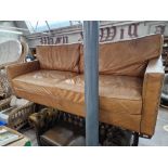 A tan leather sofa.