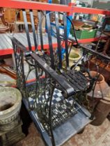 A Singer treddle chess table and 2 wrought metal chairs. with Singer bases.