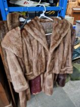 2 fur coats and 2 fur jackets.