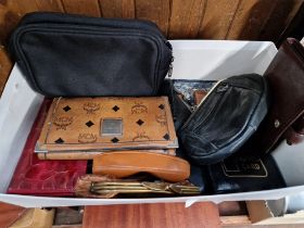 A box of leather purses.