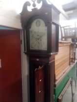 A George III eight day mahogany long case clock with weights and pendulum, quarter columns to the