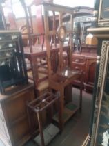 An early 20th century oak hallstand together with an oak stick stand.