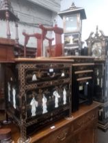 Three pieces of Chinese black lacquer and gilt decorated furniture; side cabinet, nest of tables and