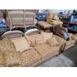 A five piece suite comprising three seater sofa, two seater sofa, two armchairs and a footstool.