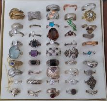 A case of mainly silver rings, marked '925' etc.