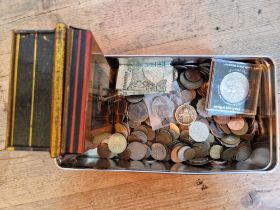 A tin of assorted GB & world coins and banknotes to include 2 x bill of rights £2 coins, 50ps and...