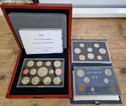 Three UK coin sets comprising of a 2006 executive proof set with presentation box & certificate...