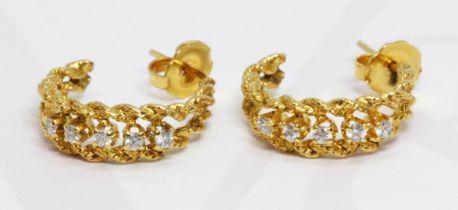 A pair of diamond earrings, twist hoop design, the butterflies marked '14K', gross weight 2.7g.