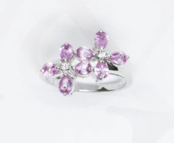 A hallmarked 9ct white gold pink sapphire and diamond cluster ring, gross weight 3.5g, size N.