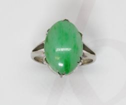 A jadeite jade cabochon ring, the six claw set stone measuring approximately 15mm x 10mm, depth 3.