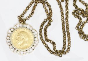 A George V 1912 half sovereign mounted, gold plated chain.