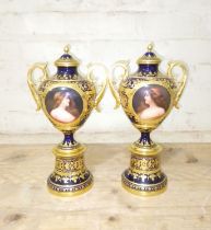 A pair of 'Vienna' porcelain urns, gilt decoration on blue ground with painted portraits 'Odalysque'