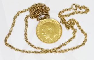 A George V 1914 half sovereign on chain, marked '9ct', gross weight 7.2g.