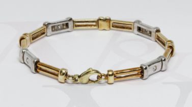 A two colour diamond bracelet, total approximate diamond weight 0.28 carats, marked '585' length