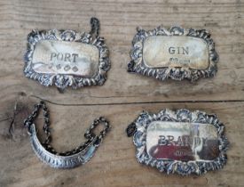 Three hallmarked silver decanter / wine labels to include Port, Gin and Brandy, Birmingham.....