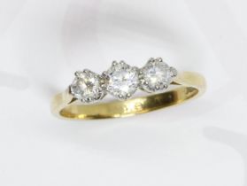 A three stone diamond ring, the round brilliant cut diamonds weighing approximately 0.50 carats,