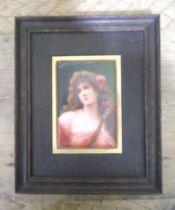 A continental porcelain plaque, circa 1900, hand painted portrait depicting a girl, indistinctly