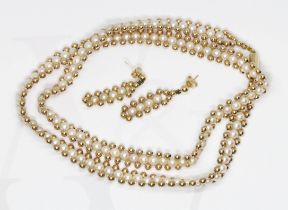 A hallmarked 9ct gold bead and pearl necklace with matching earrings, necklace length 52cm,