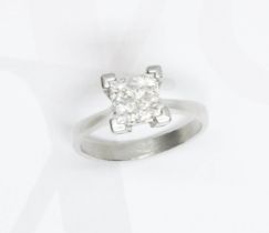 A four stone diamond ring, the four princess cut stones weighing approximately 0.60 carats in total,
