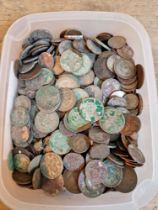 A tub of assorted UK & world coins to include some silver