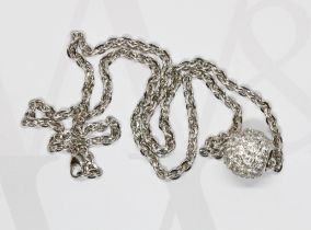 A white metal spherical cluster pendant set with CZs and marked '18K', suspended on flat anchor link