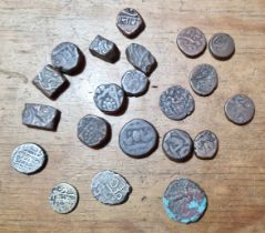 A group of assorted ancient coins.